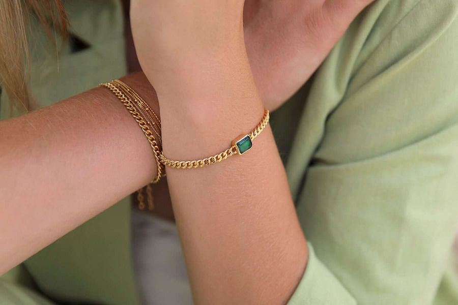layered bracelets with classic watch